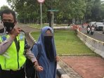 wanita bercadar ditangkap